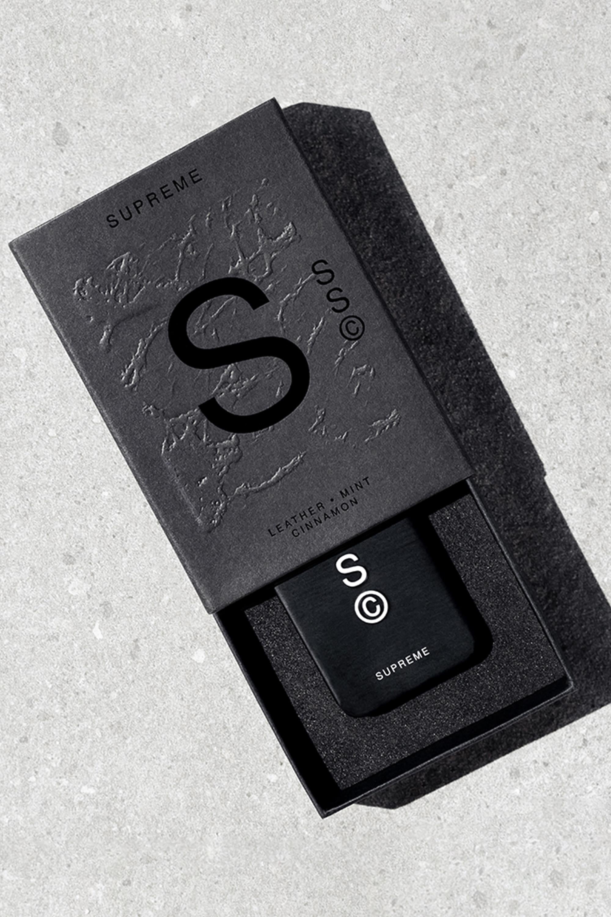 Solid State - Supreme by Solid State is a sleek black box with a bold S©, containing a matching black solid state cologne embossed with the logo. This wax-based scent features notes of leather, mint, and cinnamon.