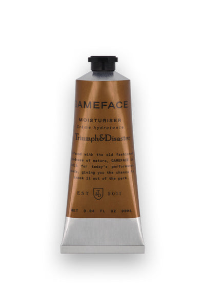 The Triumph & Disaster Gameface moisturiser - Tube features a metallic squeeze tube with a bronze label, black cap, and front-printed details—ideal for men’s skincare routines and shown upright against a white background.