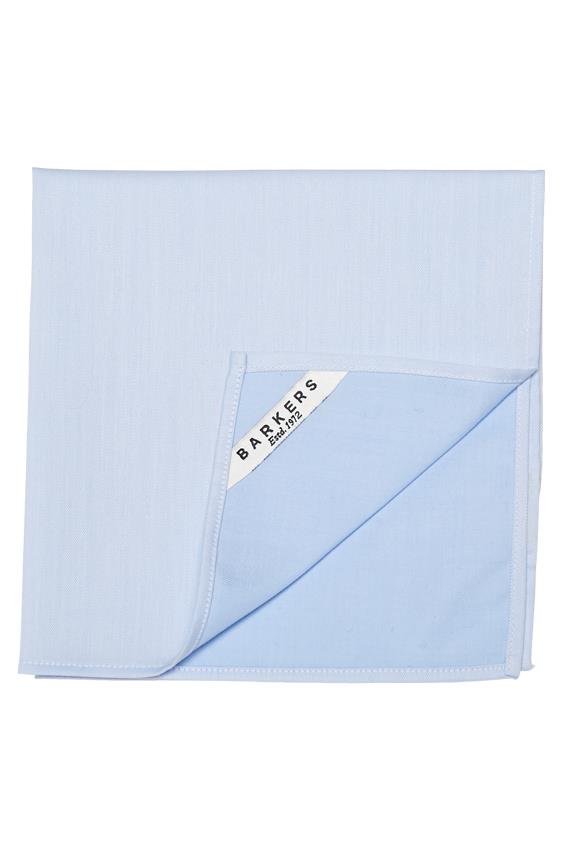 A neatly folded light blue Tribeca Pocket Square by Barkers, made from 100% cotton, with one corner turned up to reveal a white label reading BARKERS EST. 1972 in black text.