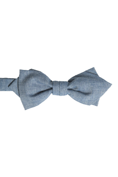 The Parisian Denim Bow by Parisian features a textured light blue design, neatly tied and centered on a white background—a stylish men's accessory for any occasion.