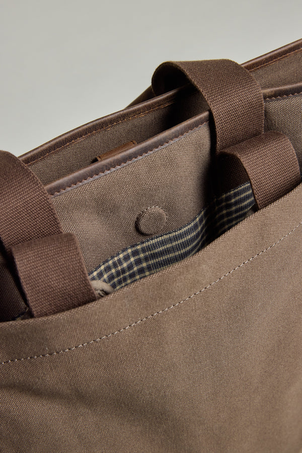 The Barkers Foxton Canvas Convertible Tote has plaid detail and fits a laptop in its outer pocket.