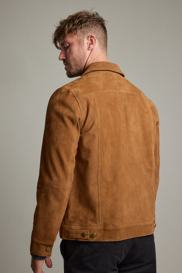 Man wearing the Jackson Suede Trucker by Barkers, seen from the back, looking left.