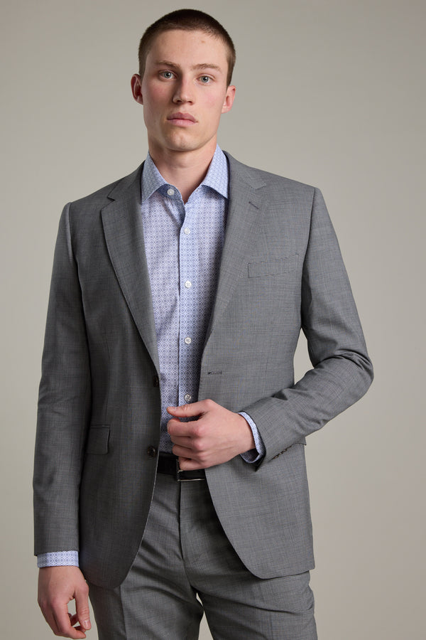 A man wearing the Barkers Henderson Houndstooth Suit Jacket stands against a plain light background, looking directly at the camera with a neutral expression.