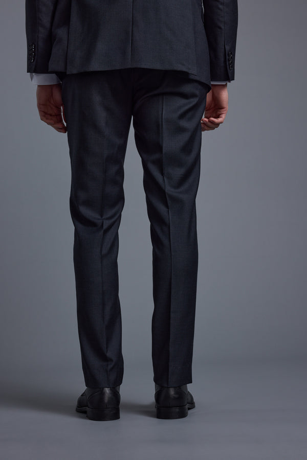 A person models the Barkers Mayfair ZQ Suit Trouser, shown from the lower back down with black shoes, standing against a plain gray background.