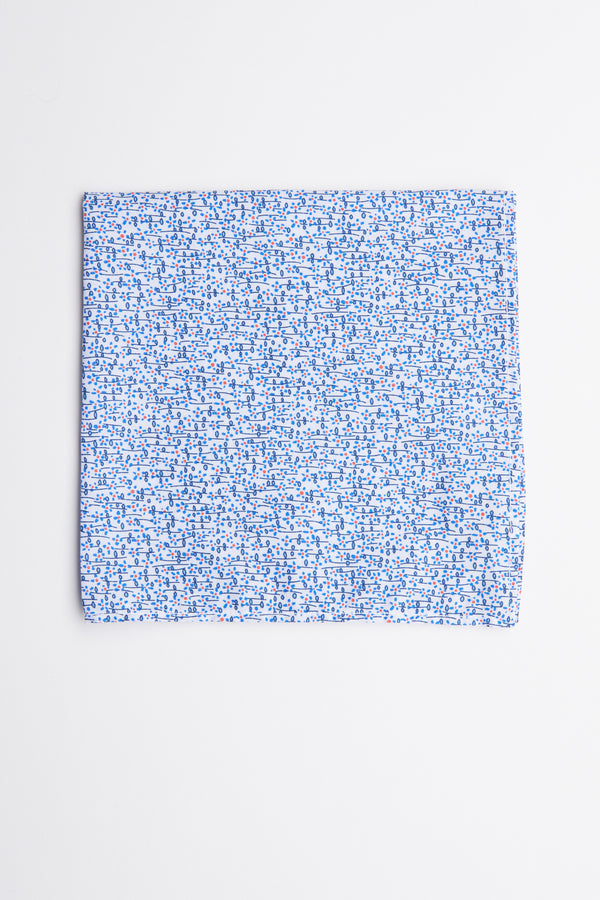 The Barkers Mildred Ditsy Flower Pocket Square features a light blue cotton fabric with small blue and red floral patterns, shown on a plain white background—a sophisticated formal accessory for any suit.