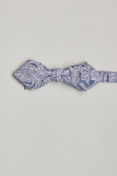 The Barkers Parisian Lincoln Bow Tie features a blue base with a light pink paisley pattern, handmade in New Zealand and shown on a plain white background.