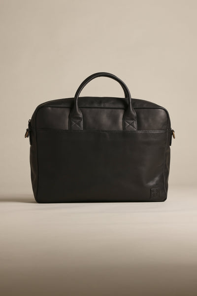 Barkers Wilkinson Leather Laptop Bag with two handles on a beige background.