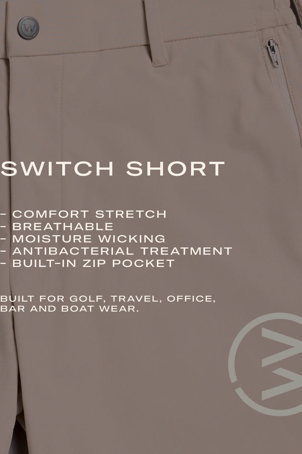 Close-up of WearEver Switch Short in beige by WearEver, featuring a button and zipper pocket. Comfort stretch fabric is breathable, moisture-wicking, quick-dry, antibacterial, and includes a built-in zip pocket for versatile activities.