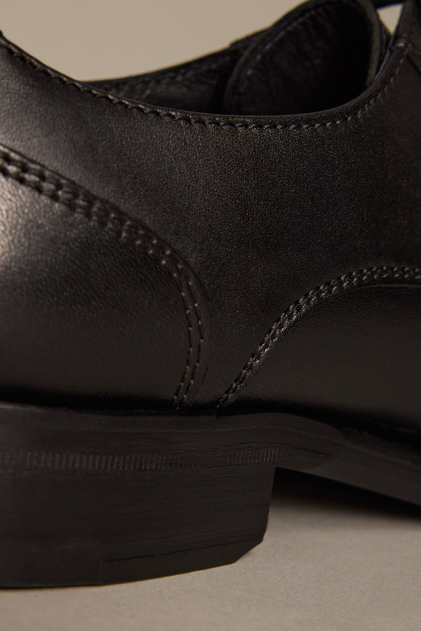 Close-up of the heel and stitching on Barkers Clayton premium leather men's dress shoes.