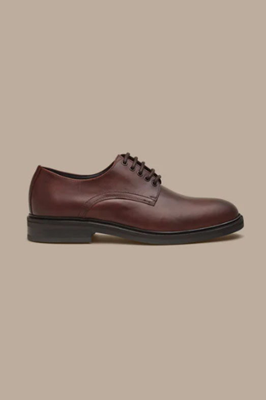 The Barkers Saville Derby Shoe is a brown leather men's dress shoe with black laces and a black sole, shown in side profile on a plain beige background.