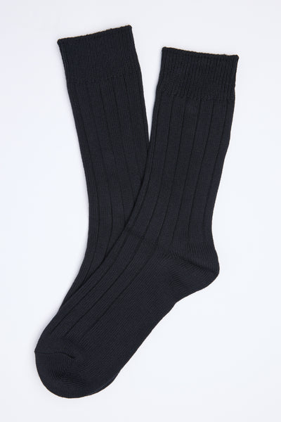 The Barkers Hutt Boot Sock is a black ribbed cotton blend pair, shown slightly overlapping on a white background—an everyday essential for comfort and style.
