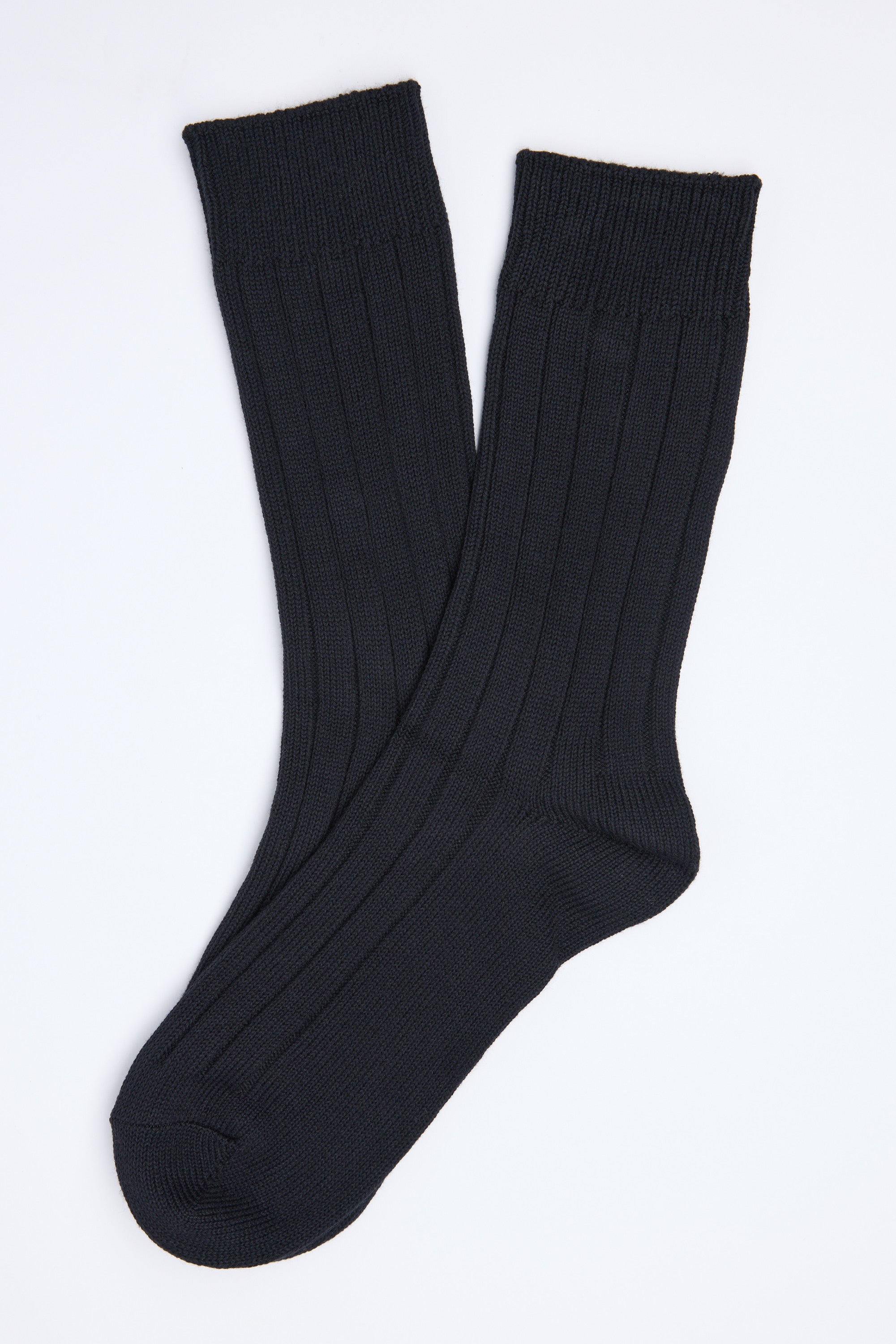 The Barkers Hutt Boot Sock is a black ribbed cotton blend pair, shown slightly overlapping on a white background—an everyday essential for comfort and style.