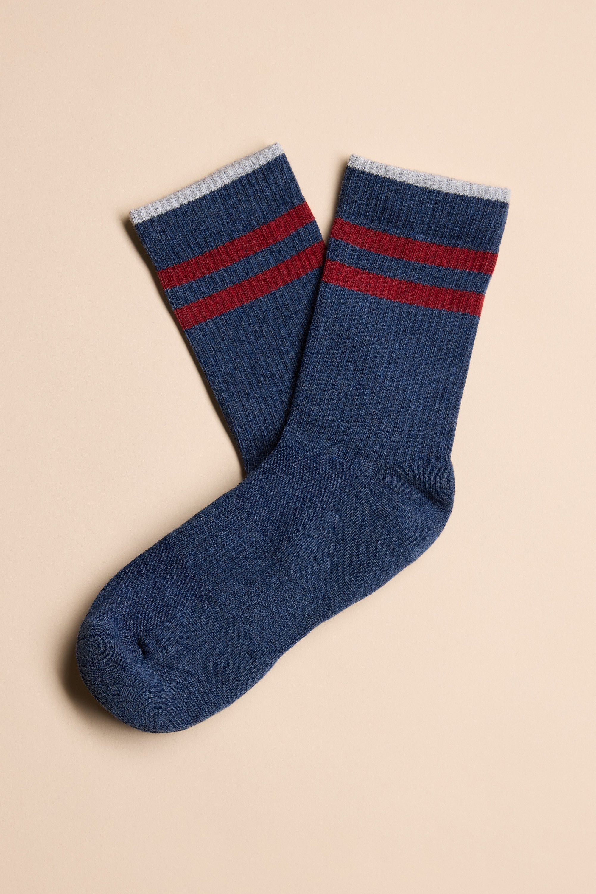 Barkers Emerson Sport Sock: blue crew socks with two red stripes, white cuffs, beige background.