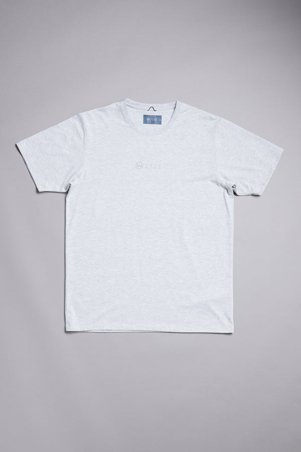 The WearEver Outbound T-Shirt by WearEver is a light grey short-sleeve performance tee with a small chest logo, laid flat on a grey background. This UPF t-shirt combines style and comfort for your everyday routine.