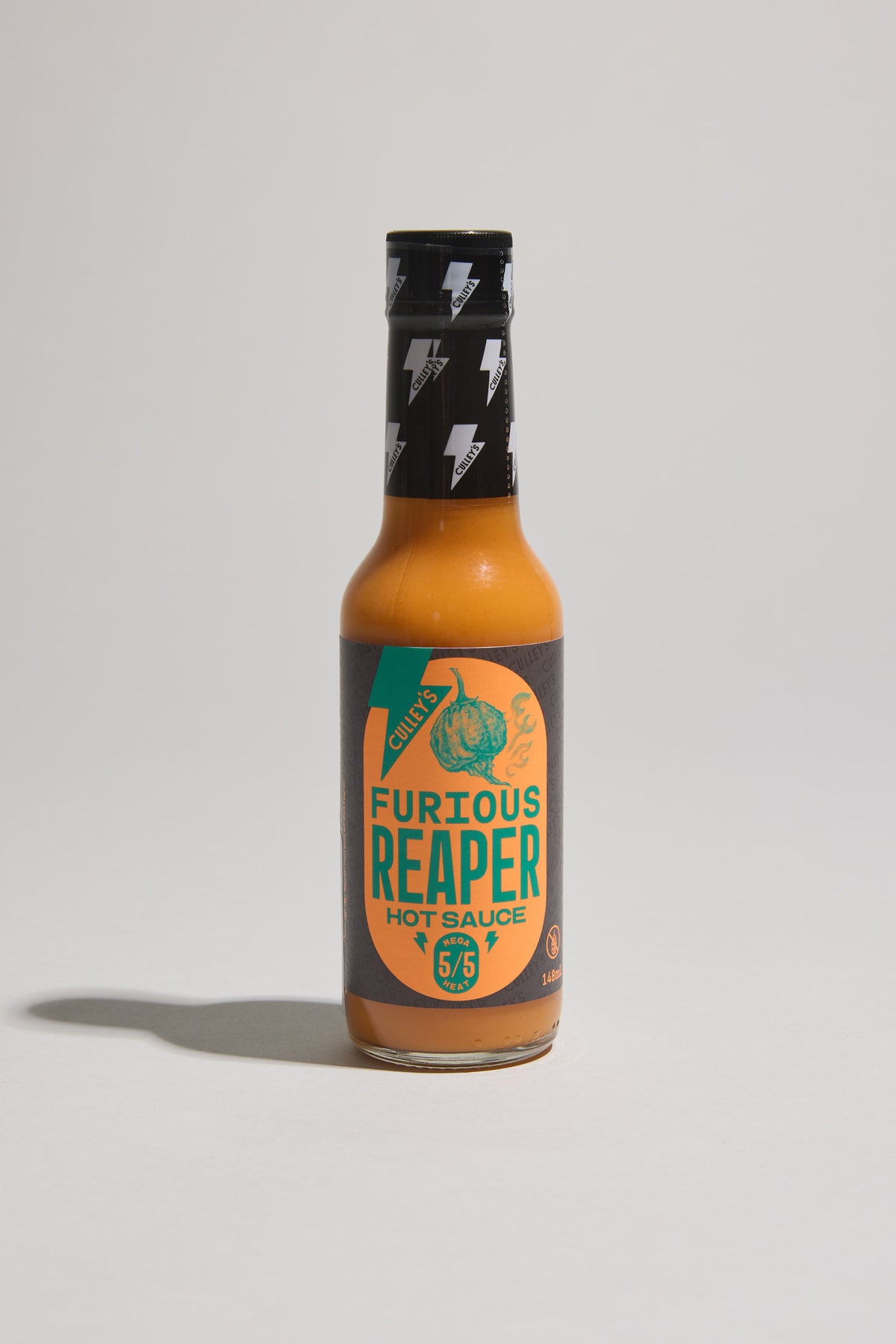 A bottle of Culley’s Furious Reaper Hot Sauce with a black label and lightning bolts cap.