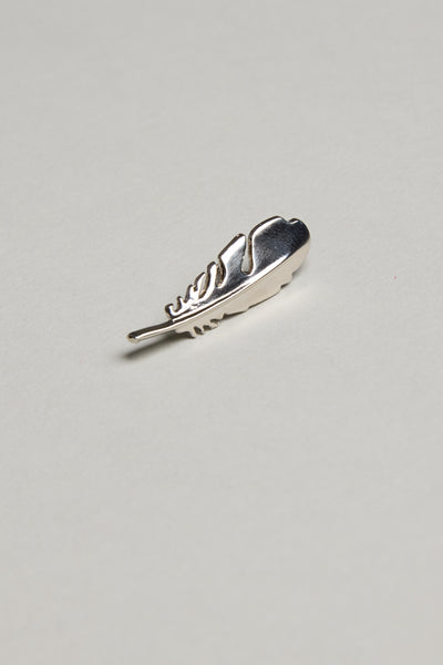 The Barkers Feather Touch Lapel Pin, featuring a polished silver finish, rests on a plain light gray background—a sophisticated accessory perfect for any formal occasion.