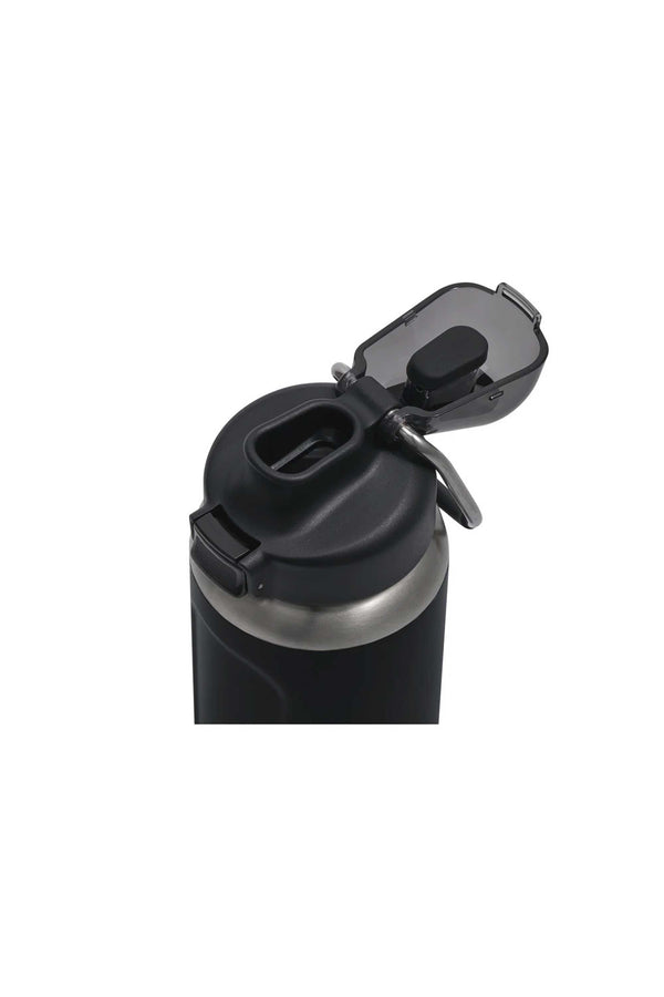 A close-up of the Stanley Wellspring Bottle 24 OZ in black, shown with its flip-top lid open to reveal a leak-resistant spout and attached metal clip, set against a plain white background.