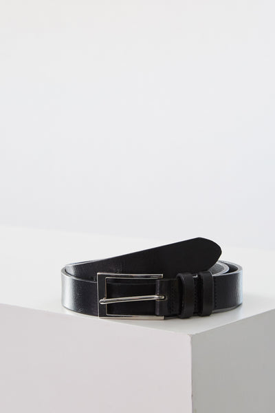 The Barkers Frances Leather Belt, featuring a black leather strap and a square buckle, is rolled up on a white surface. This classic accessory adds timeless style to any outfit in New Zealand.