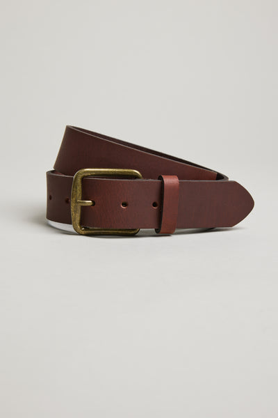 Barkers Rossello Leather Jean Belt with brass buckle, coiled on a light background.