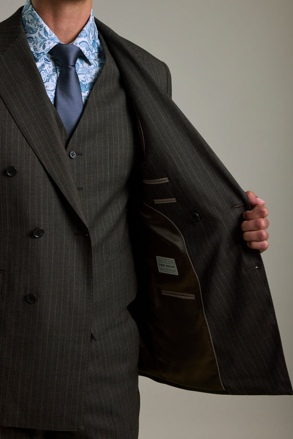 Man in a Barkers Radcliffe Stripe Double Breasted Suit Jacket shows the merino wool lining.
