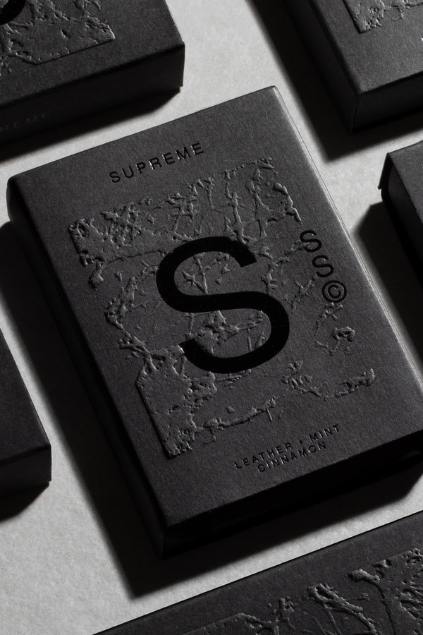 Solid State - Supreme: pocket cologne with textured black box, large S; Leather, Mint, Cinnamon.