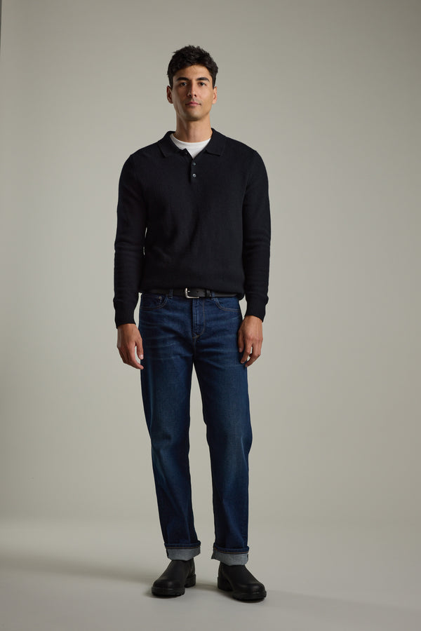 Man wearing Barkers Ainsley Woollen Long Sleeve Polo with blue jeans and black shoes.
