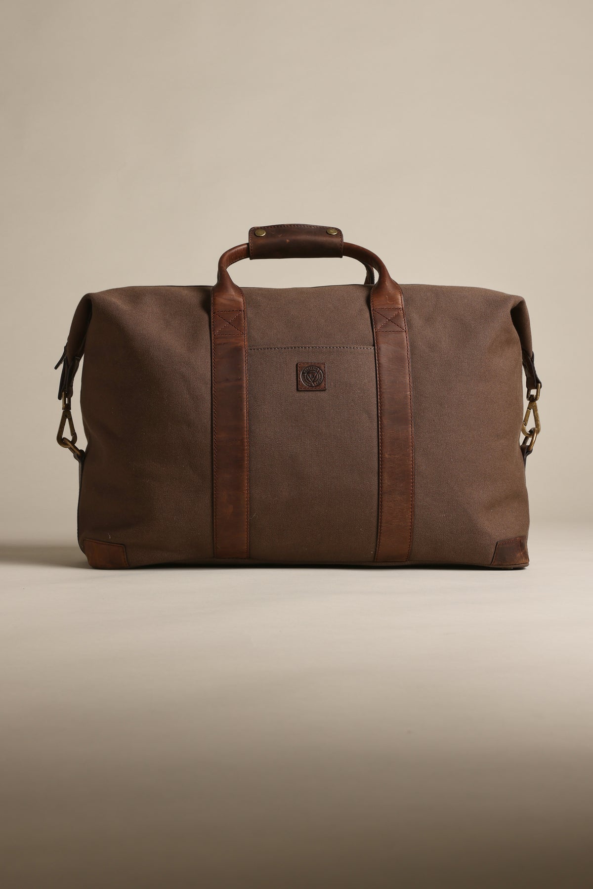 Barkers Newman Canvas Weekender with leather straps on a neutral background.