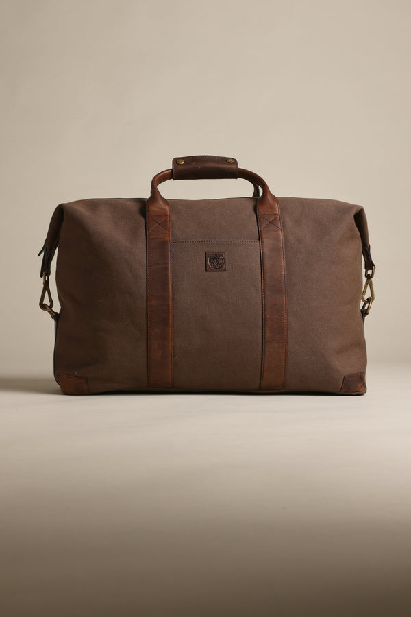 Barkers Newman Canvas Weekender with leather straps on a neutral background.