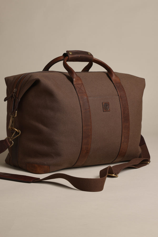 Barkers Newman Canvas Weekender duffel with leather straps and shoulder strap shown.