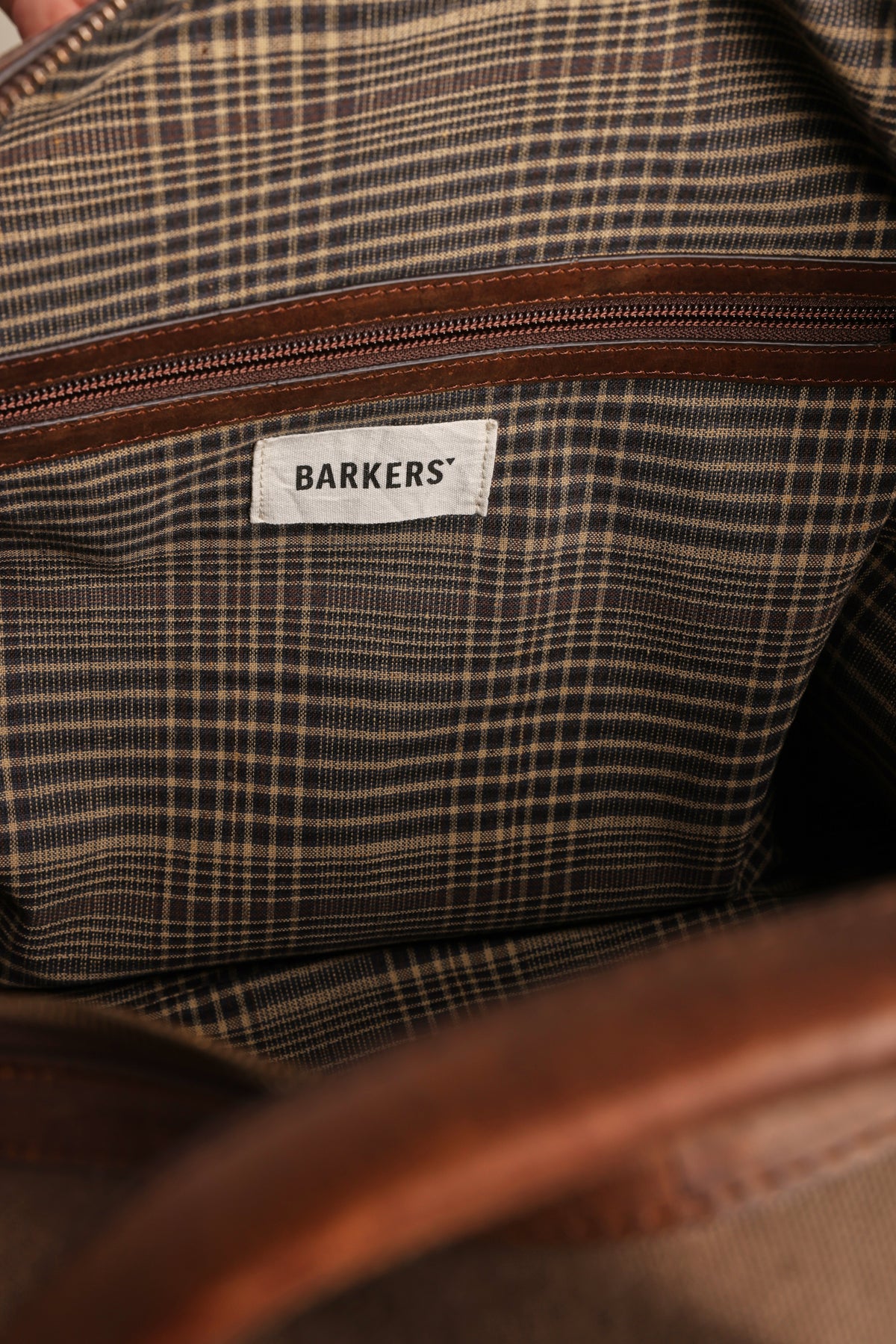 Newman Canvas Weekender: brown interior, plaid lining, zip pocket, and Barkers label.