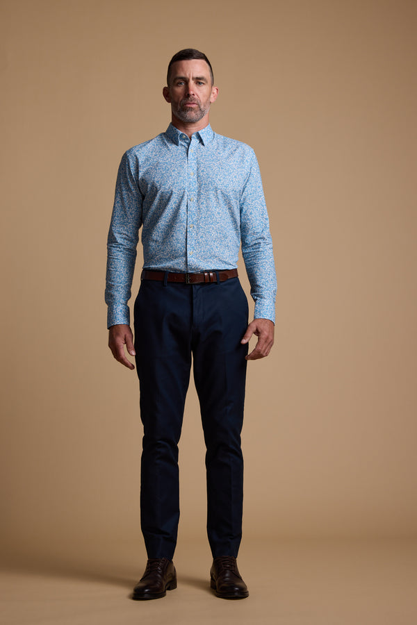 A man wearing the Barkers Torrey Print Shirt, made from responsibly sourced cotton.