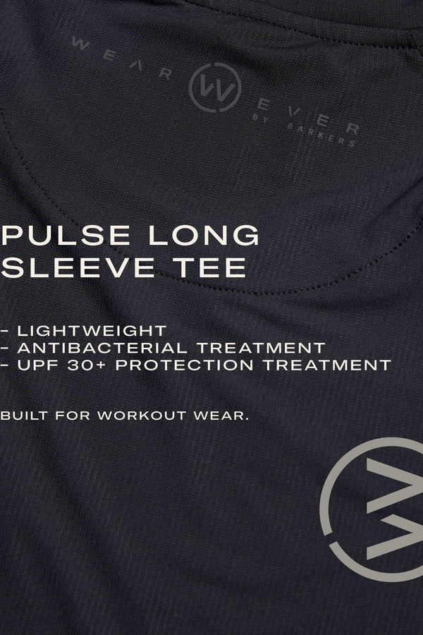 Close-up of the WearEver Pulse Long Sleeve Tee—black, lightweight, moisture-wicking, antibacterial, and UPF 30+ for superior workout comfort. The WearEver logo is visible.