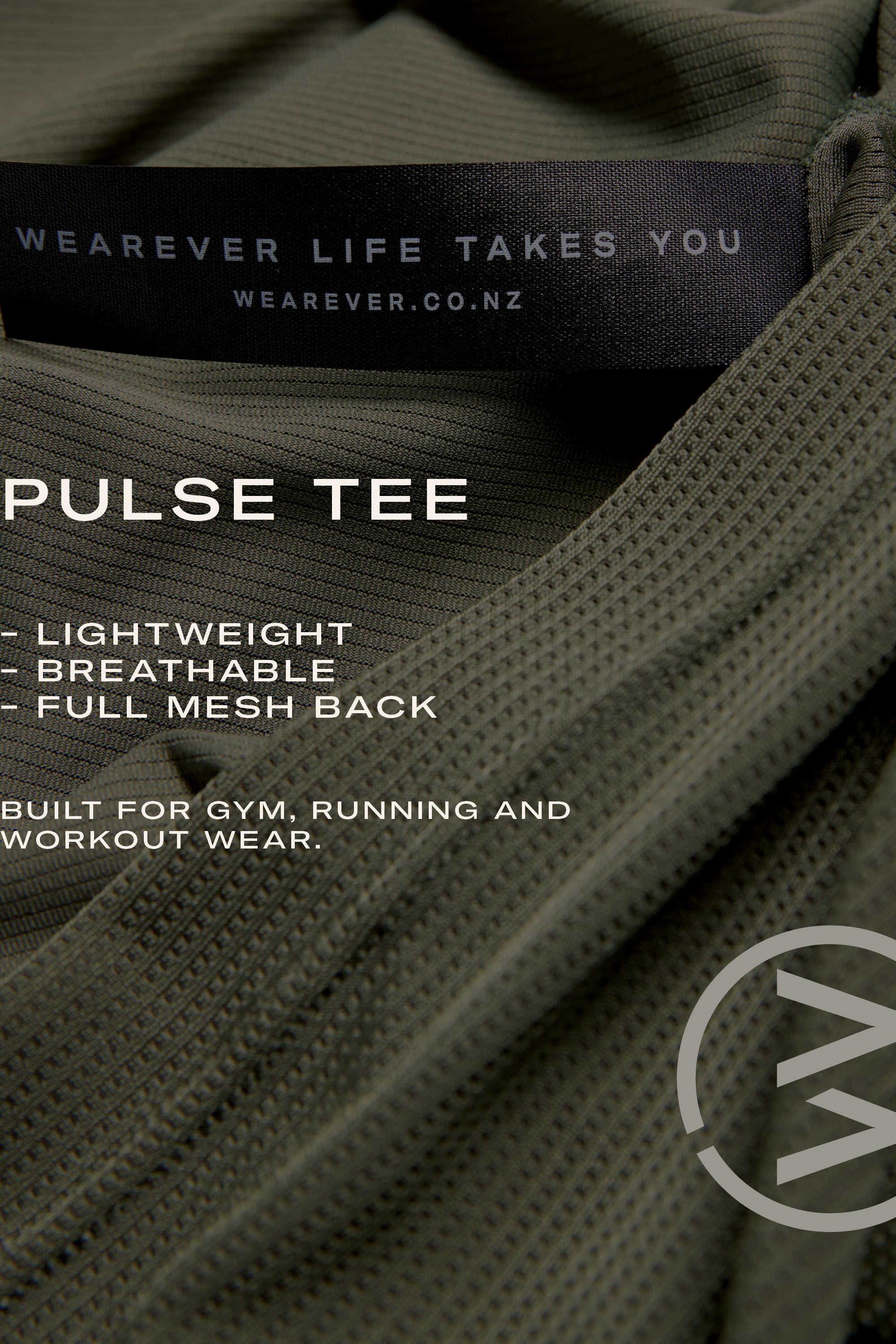 Close-up of the olive green WearEver Pulse Tee, a lightweight, breathable performance shirt with a full mesh back and black WEARVER LIFE TAKES YOU label. Designed by WearEver for moisture-wicking comfort at the gym or running.