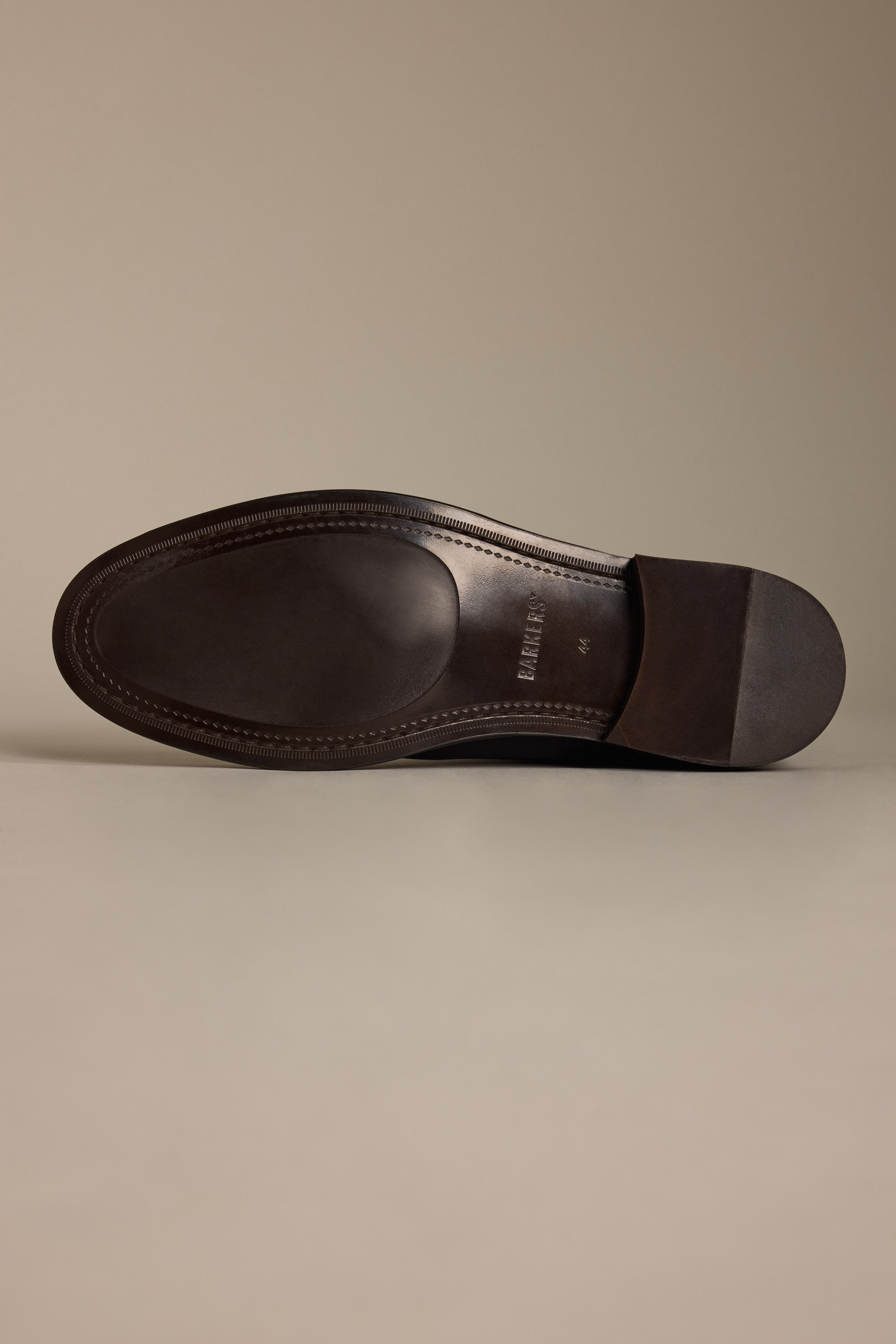 The Barkers Peter Chelsea Boot in brown is displayed sole-up on a neutral background.