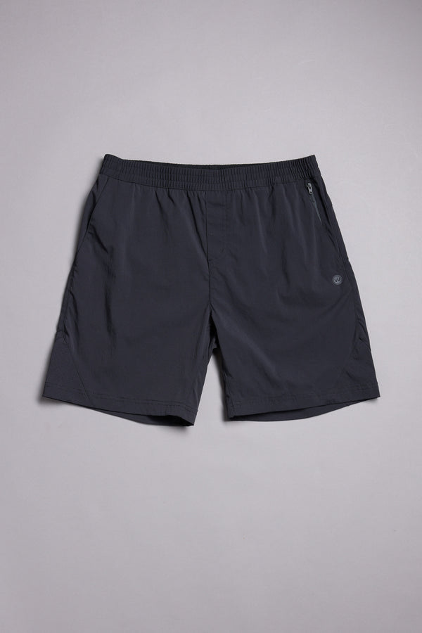 The WearEver Agile Short by WearEver is a dark gray, lightweight stretch short with a 7-inch inseam, elastic waistband, side pockets, and a small logo on the left leg, shown laid flat on a light gray background.