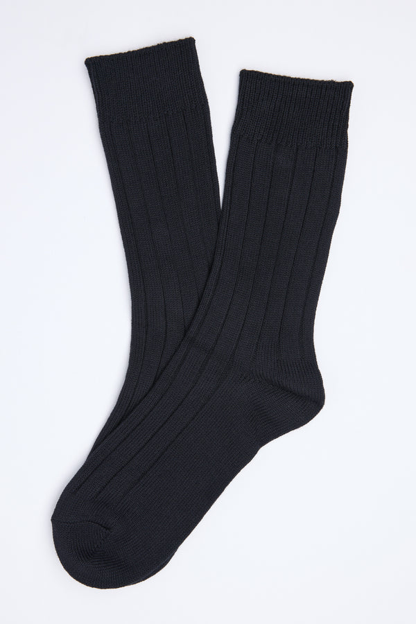 The Barkers Hutt Boot Sock is a black ribbed cotton blend pair, shown slightly overlapping on a white background—an everyday essential for comfort and style.