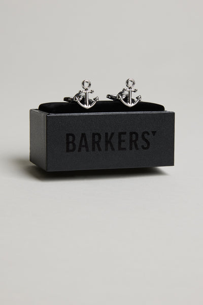 A pair of Barkers Anchor Cufflinks is displayed on a black box with "BARKERS" printed on it, set against a plain light grey background.