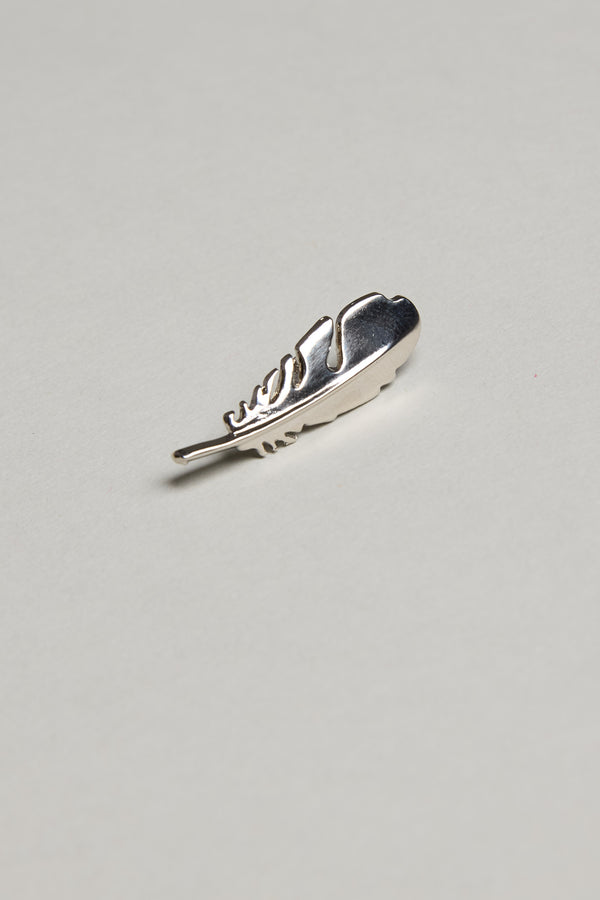 The Barkers Feather Touch Lapel Pin, featuring a polished silver finish, rests on a plain light gray background—a sophisticated accessory perfect for any formal occasion.