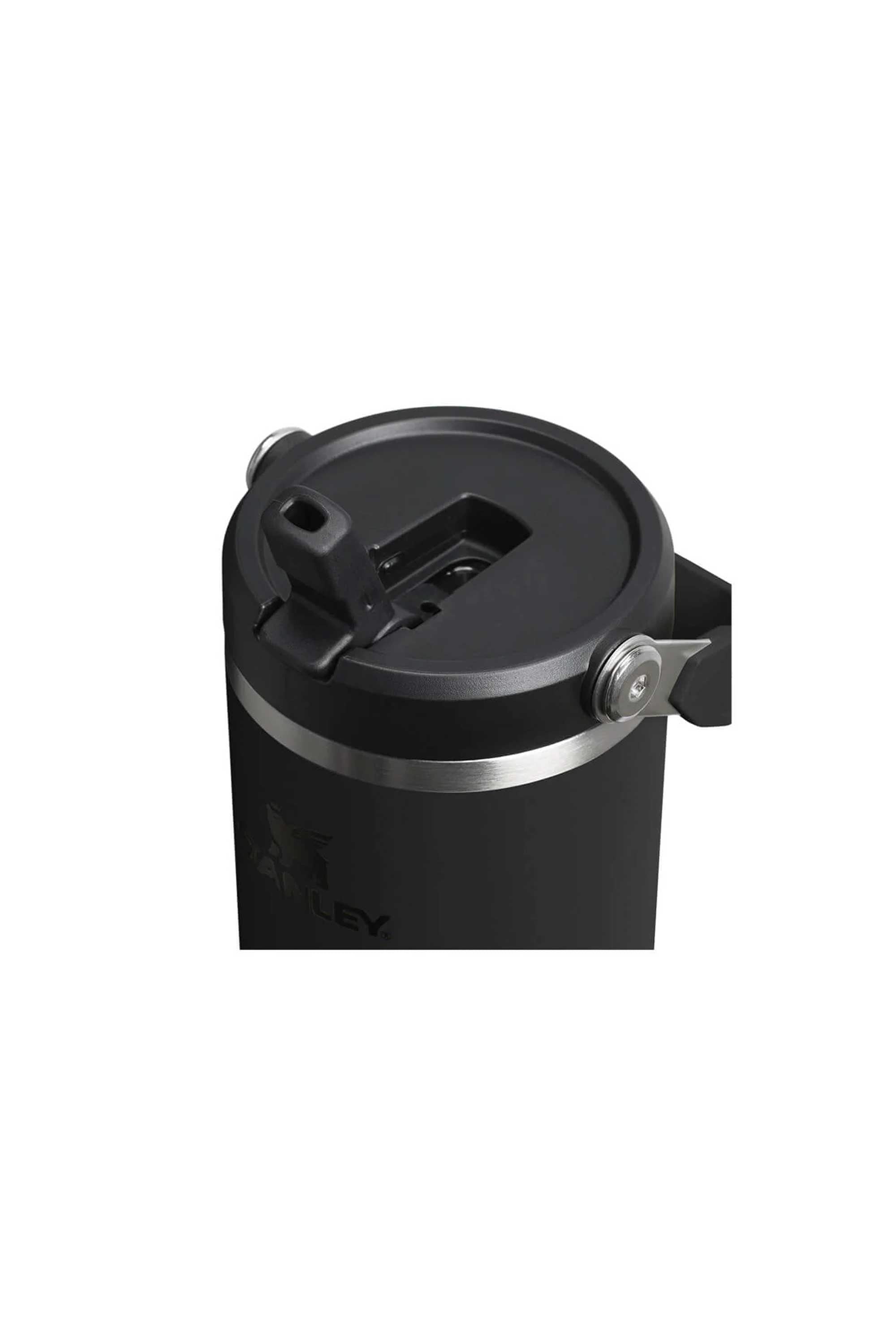 A close-up of the Stanley IceFlow Flip Straw Tumbler 30 OZ in black, featuring a lid with a flip straw and sturdy silver handle—ideal for keeping drinks hot or cold with its vacuum insulation.